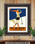 a framed poster of a skier on a ski resort